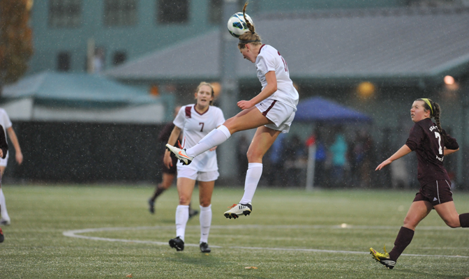 Central Washington's Hadli Farrand (center) meets the ball with her head in the first semifinal match of the 2013 GNAC Women's Soccer Tournament.